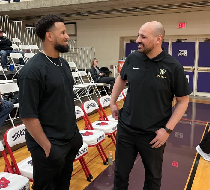 Keynan Middleton (left) and Putnam head coach Ali Mihub 
